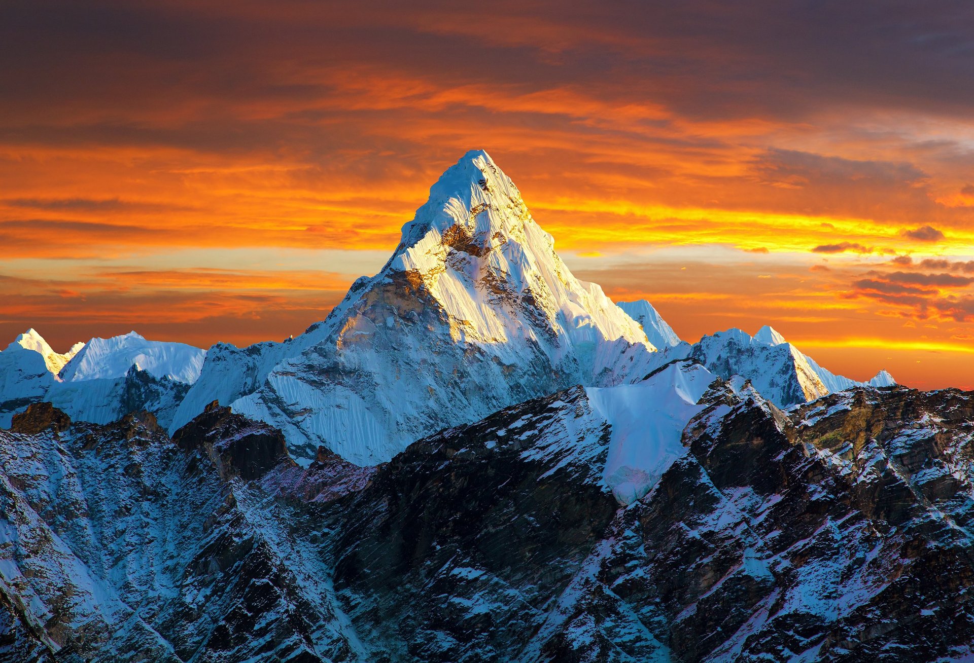 Snowy mountain range at sunset